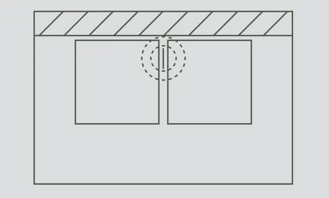 pose des dalles sur plot le long d'un mur